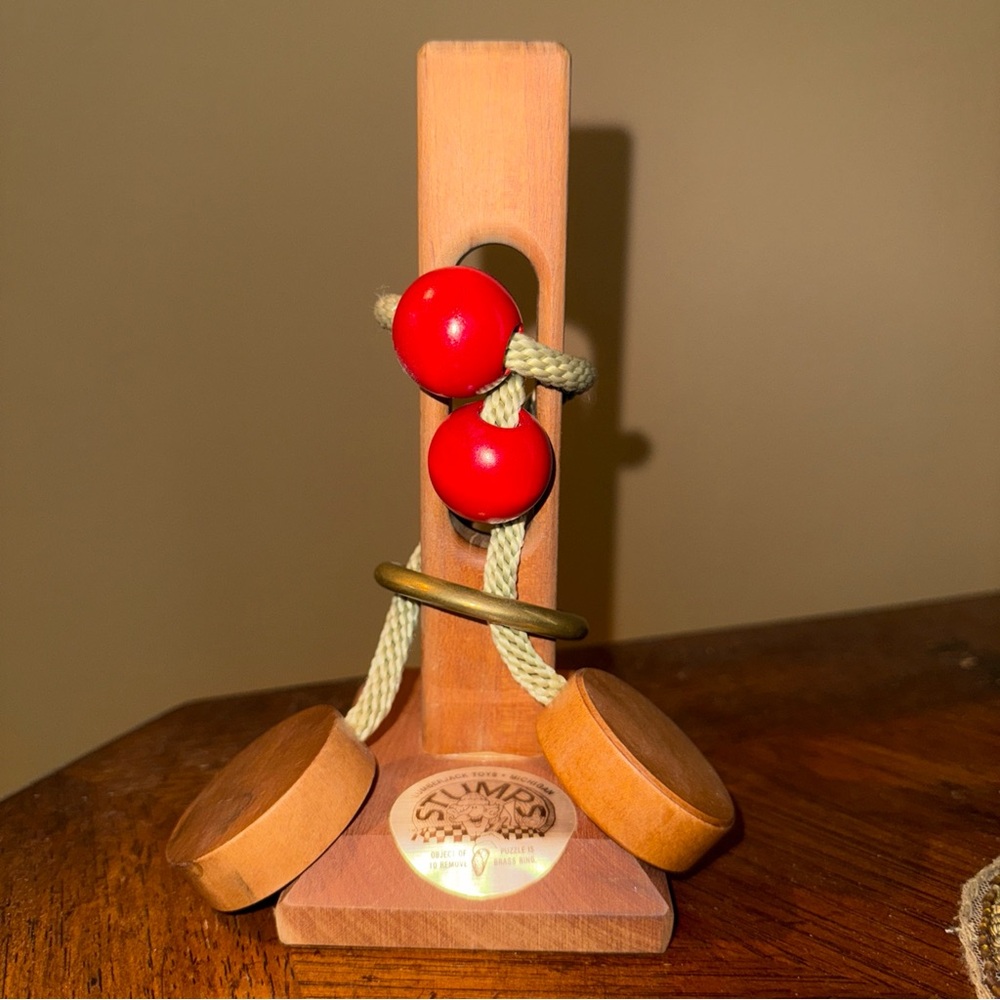 Stumped Wooden Puzzle with Red Beads